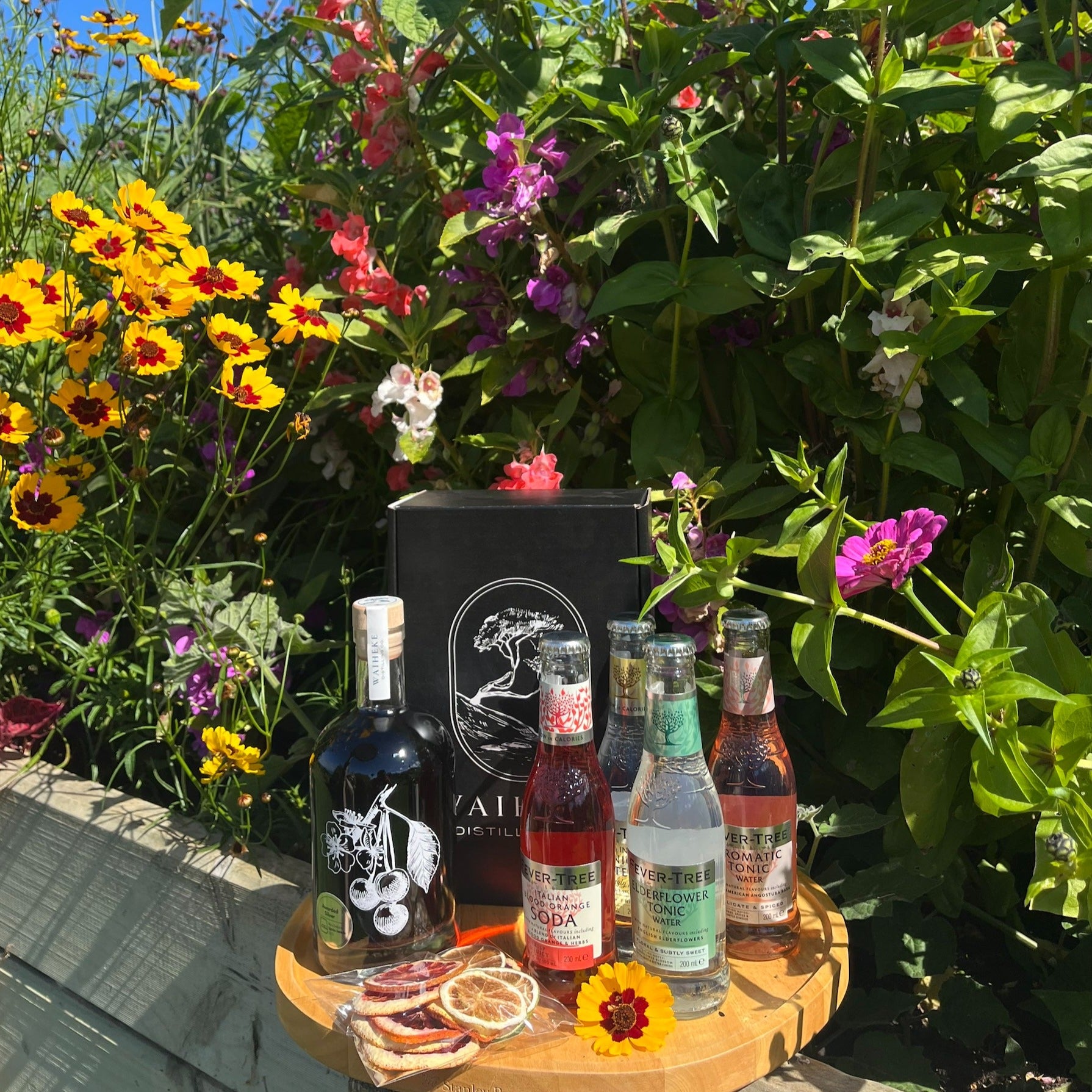 Set of Waiheki Distilling products with flowers